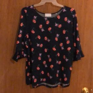 Navy and floral silky blouse.